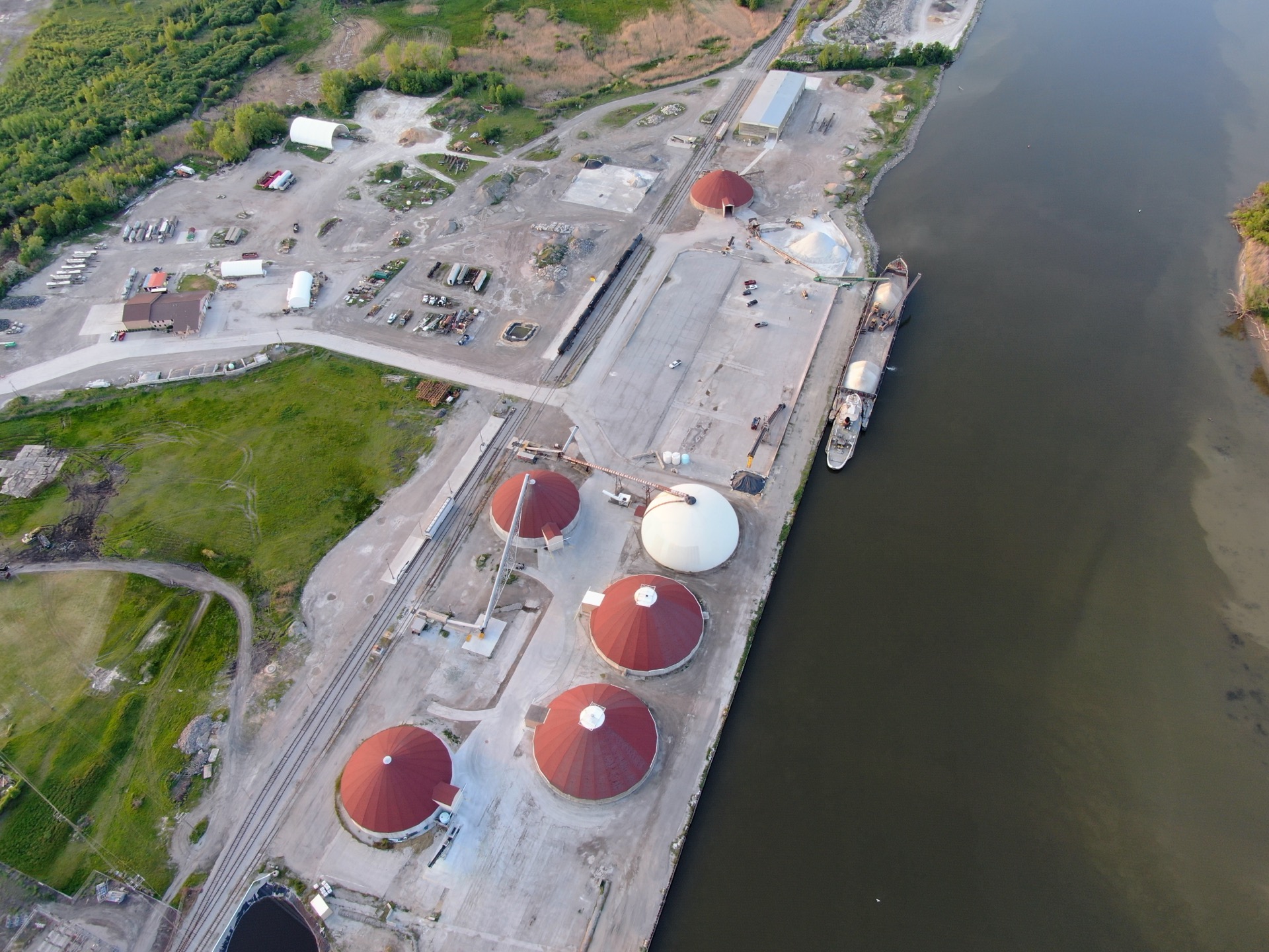 Aerial view of Zilwaukee dock with barge and storage tanks