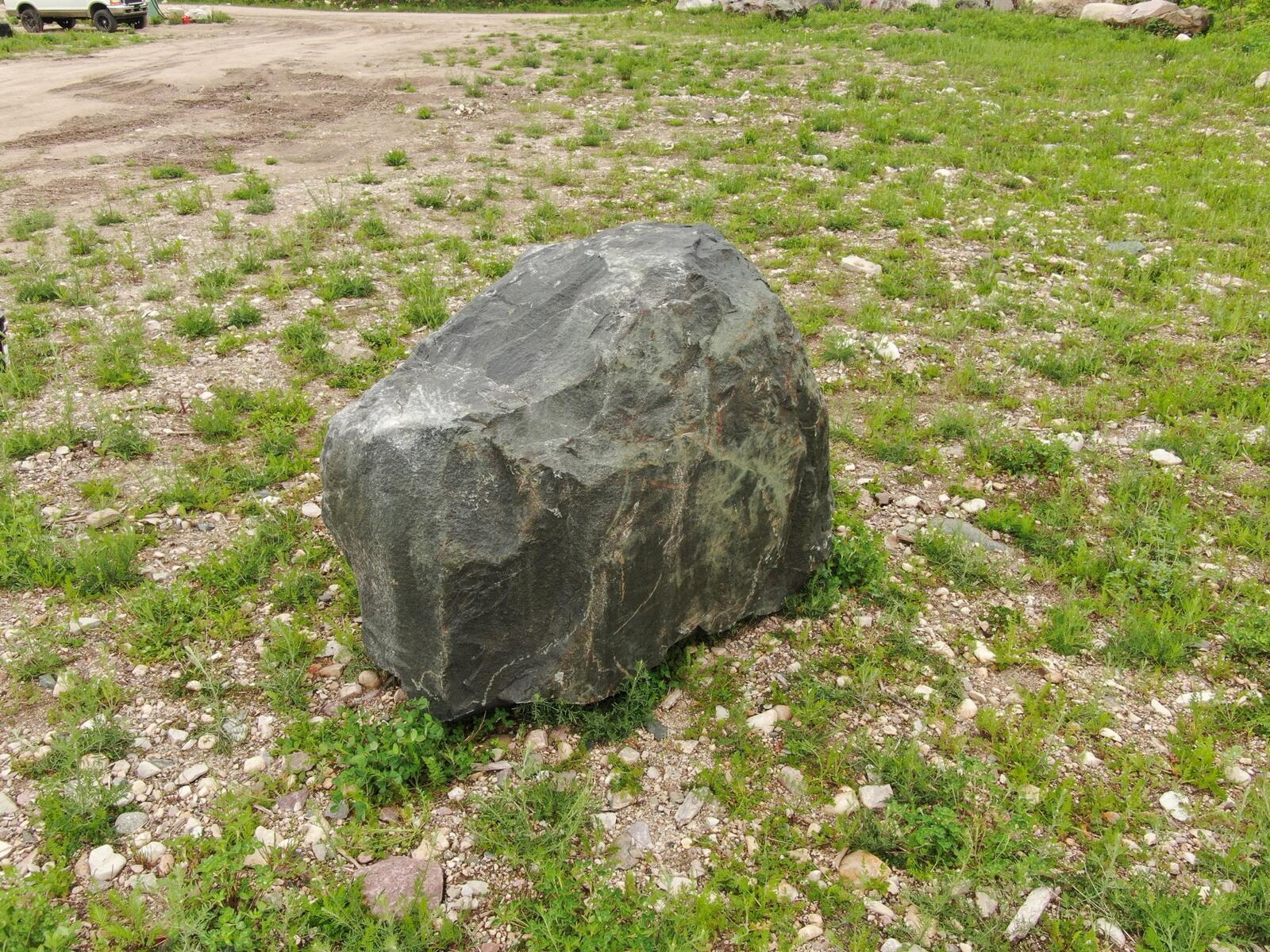 Large dark granite character boulder