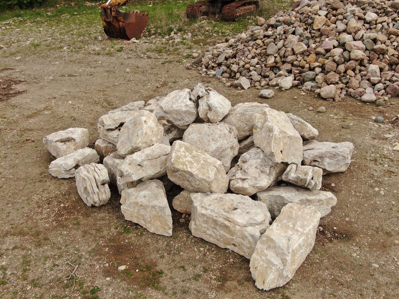 Stacked character limestone boulders ready for selection