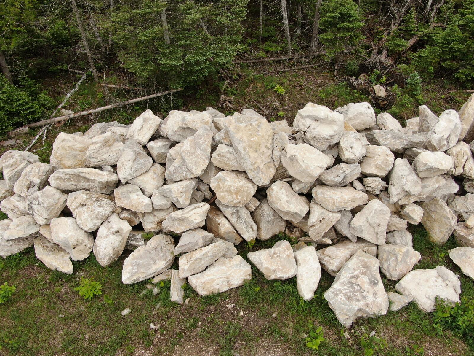 Dense pile of large irregular limestone character stones