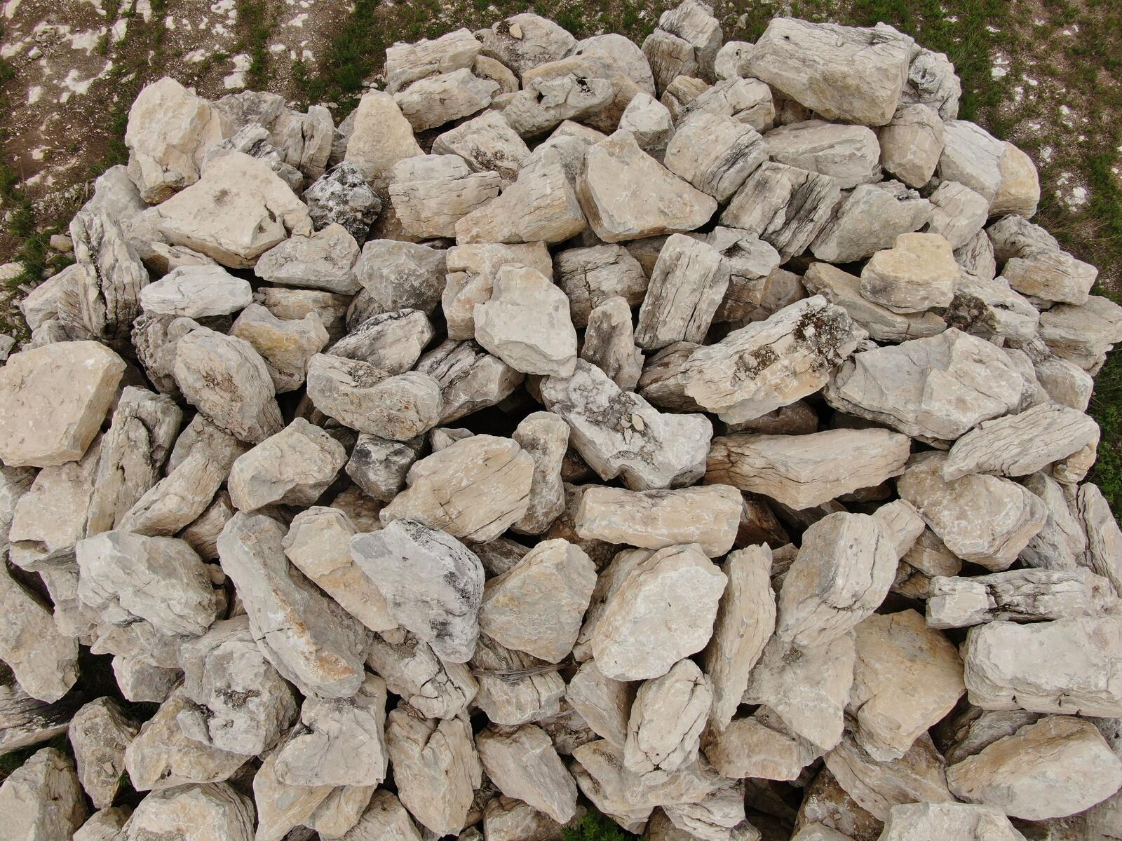 Dense overhead view of character limestone stockpile