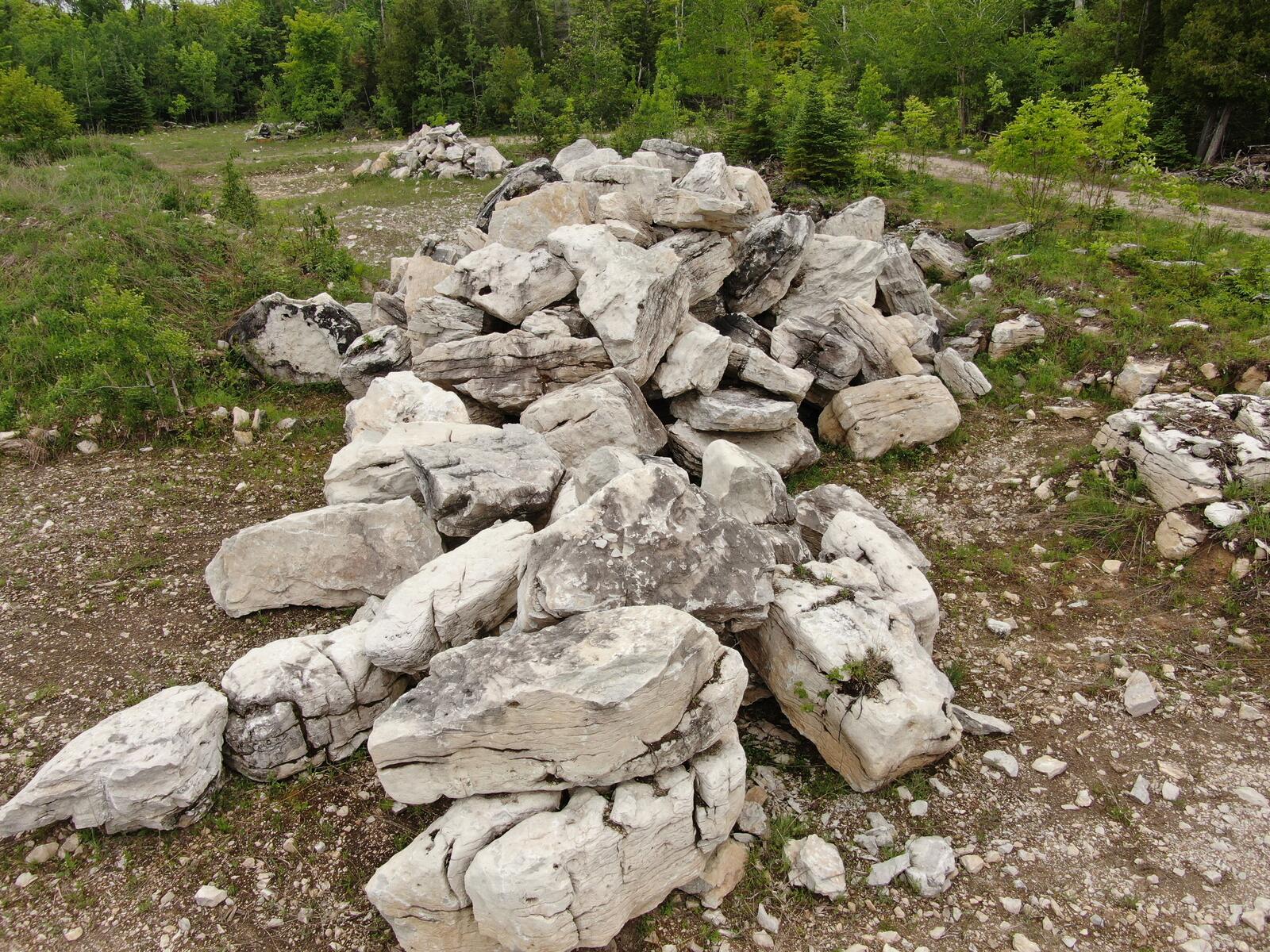 Irregular character limestone boulders in a stockpile