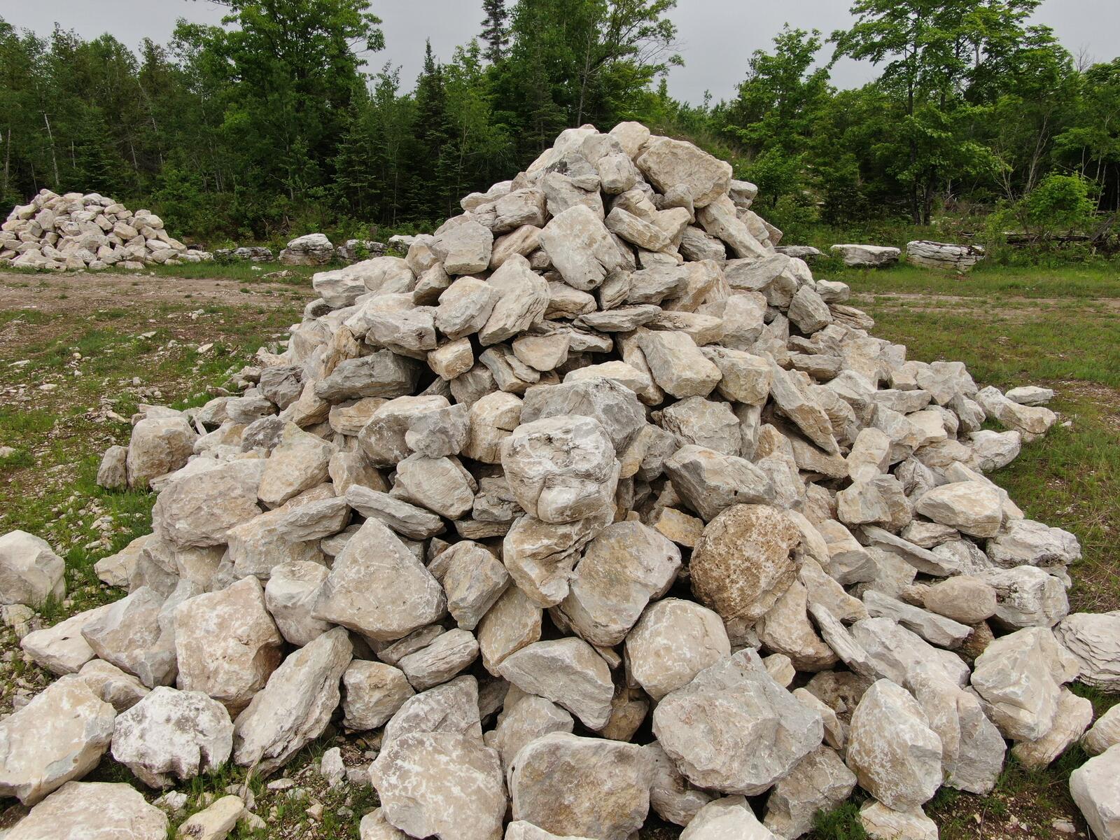 Tall conical pile of character limestone boulders