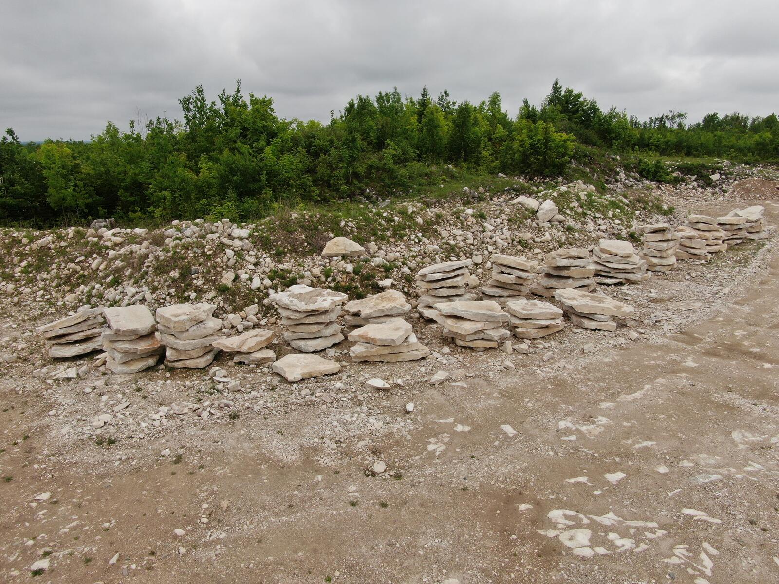 Stacks of natural limestone flagstone and slabs
