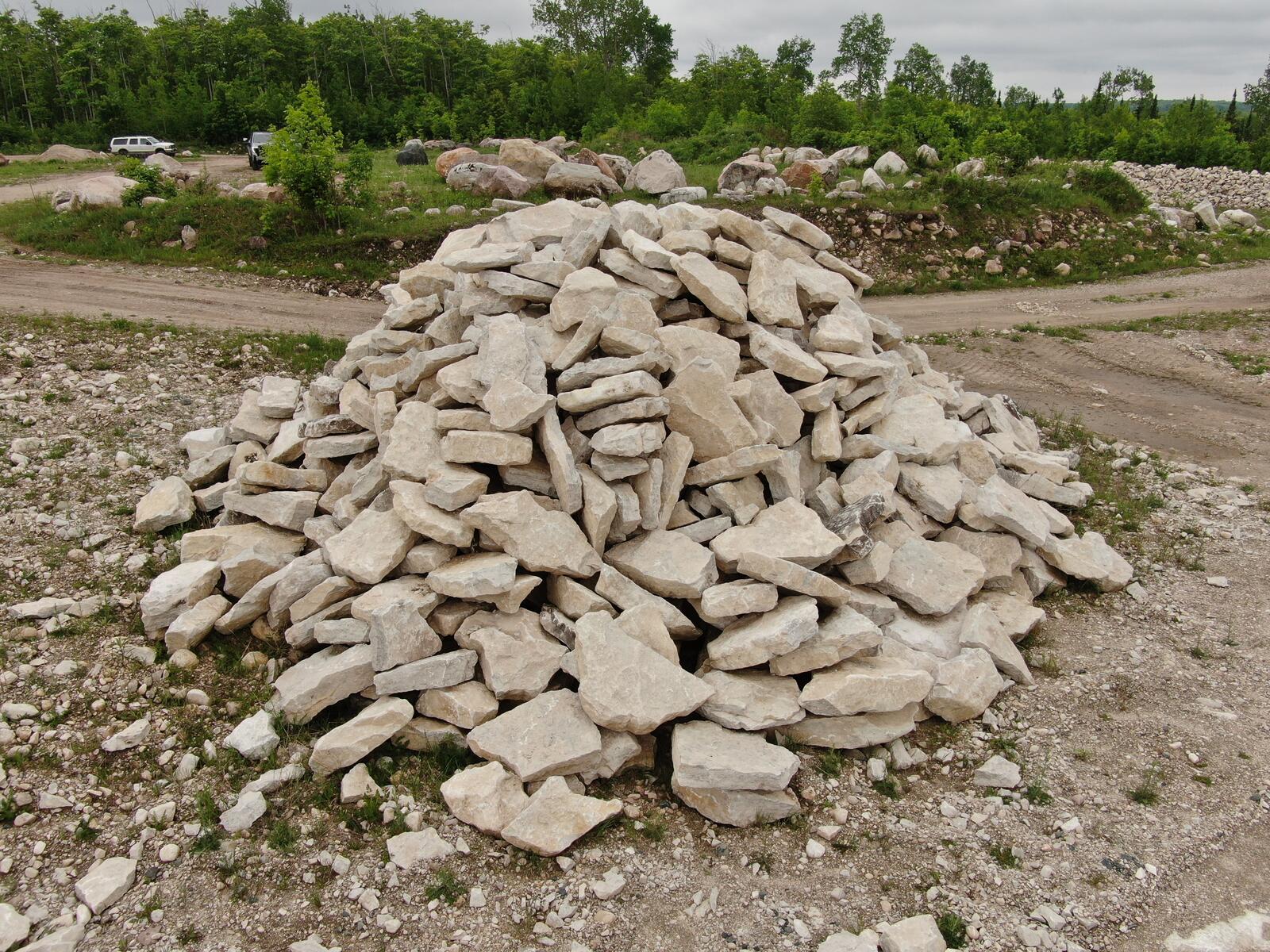 Stockpile of flat limestone outcropping stone