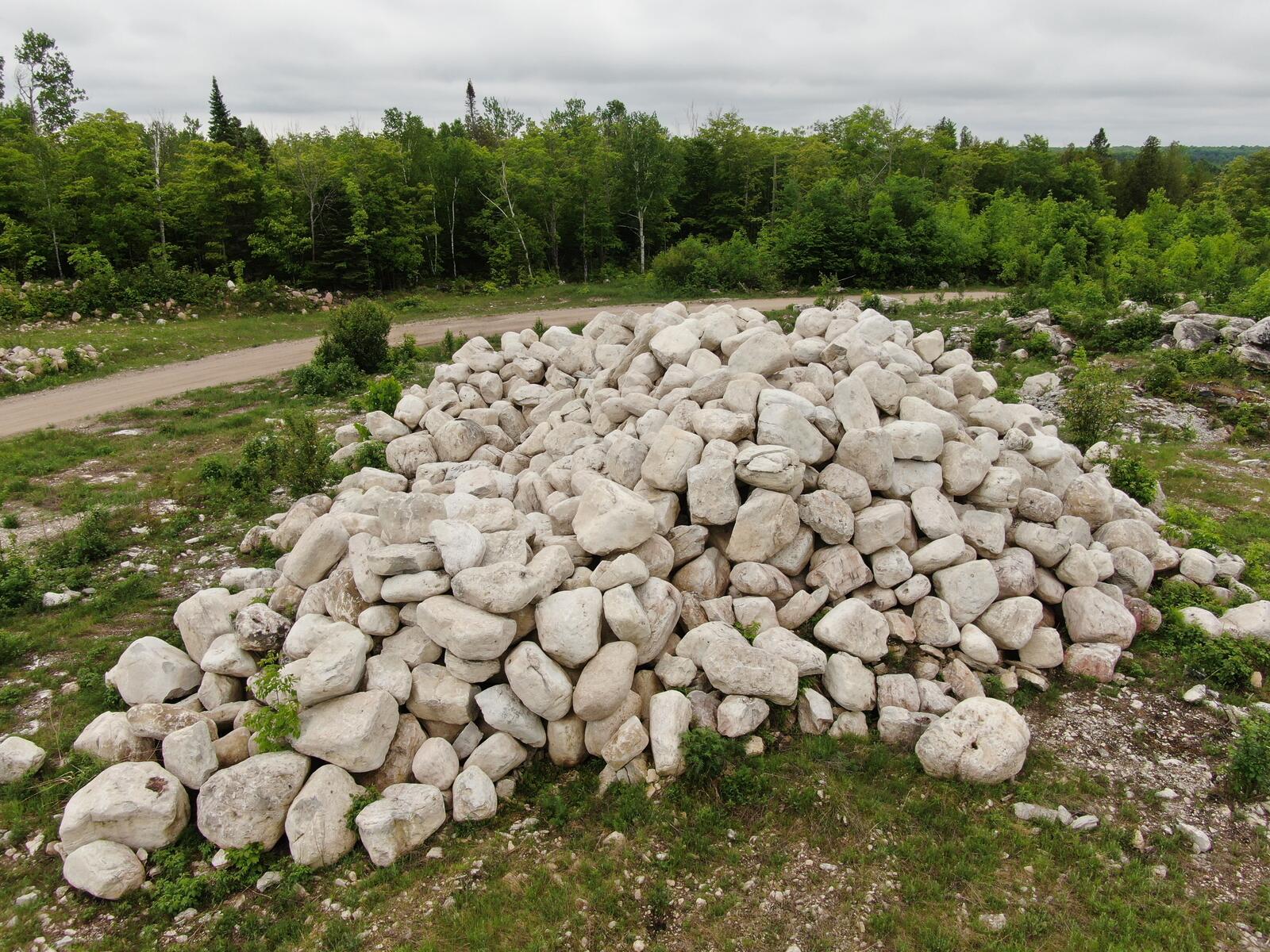 Conical pile of rounded limestone landscape stone