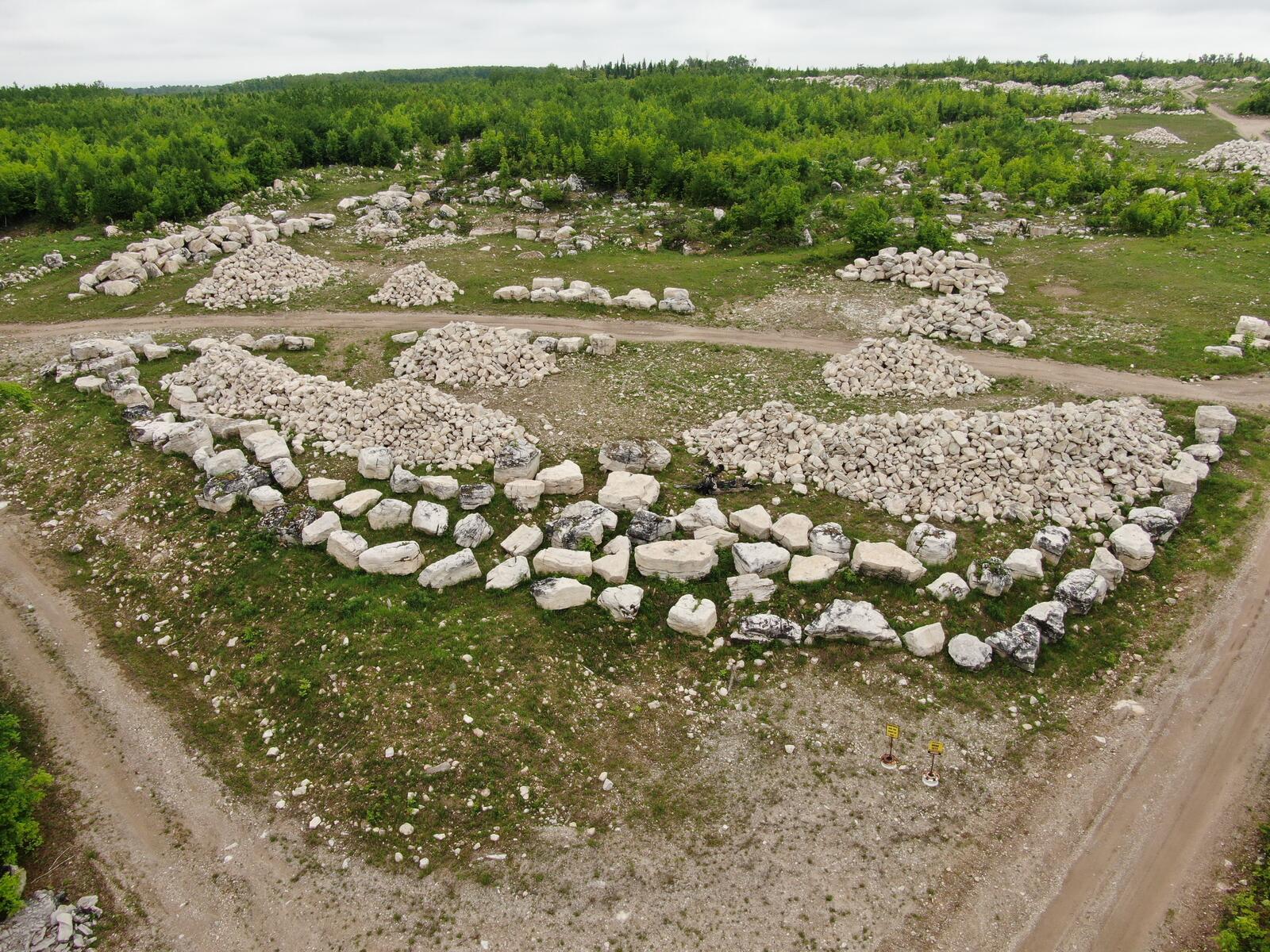 Wide aerial of multiple character stone stockpiles