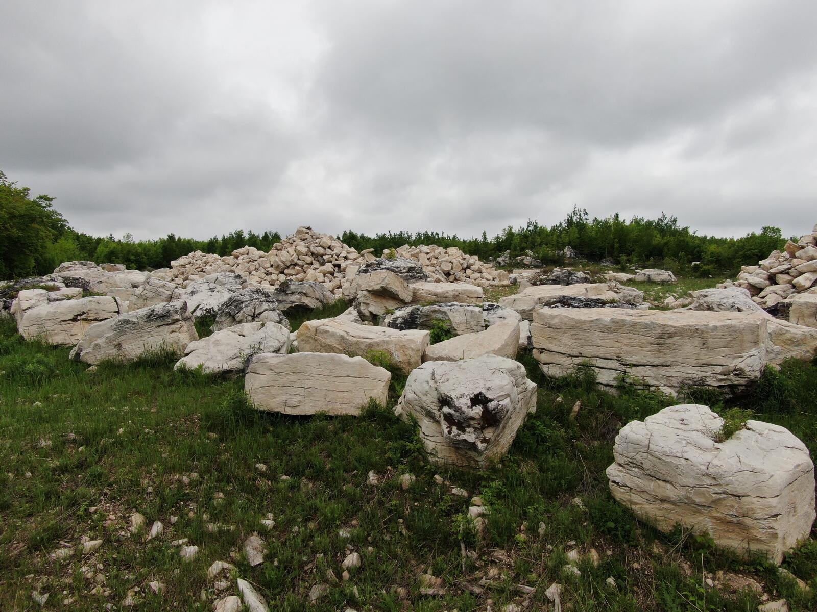 Character limestone blocks with stockpile behind