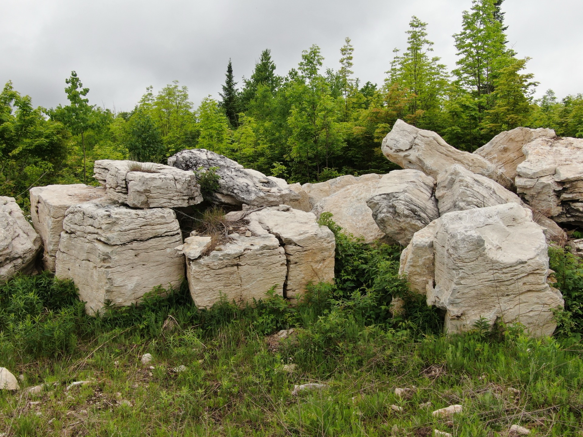 Large natural limestone boulders at Stone Mountain quarry in Goetzville, Michigan