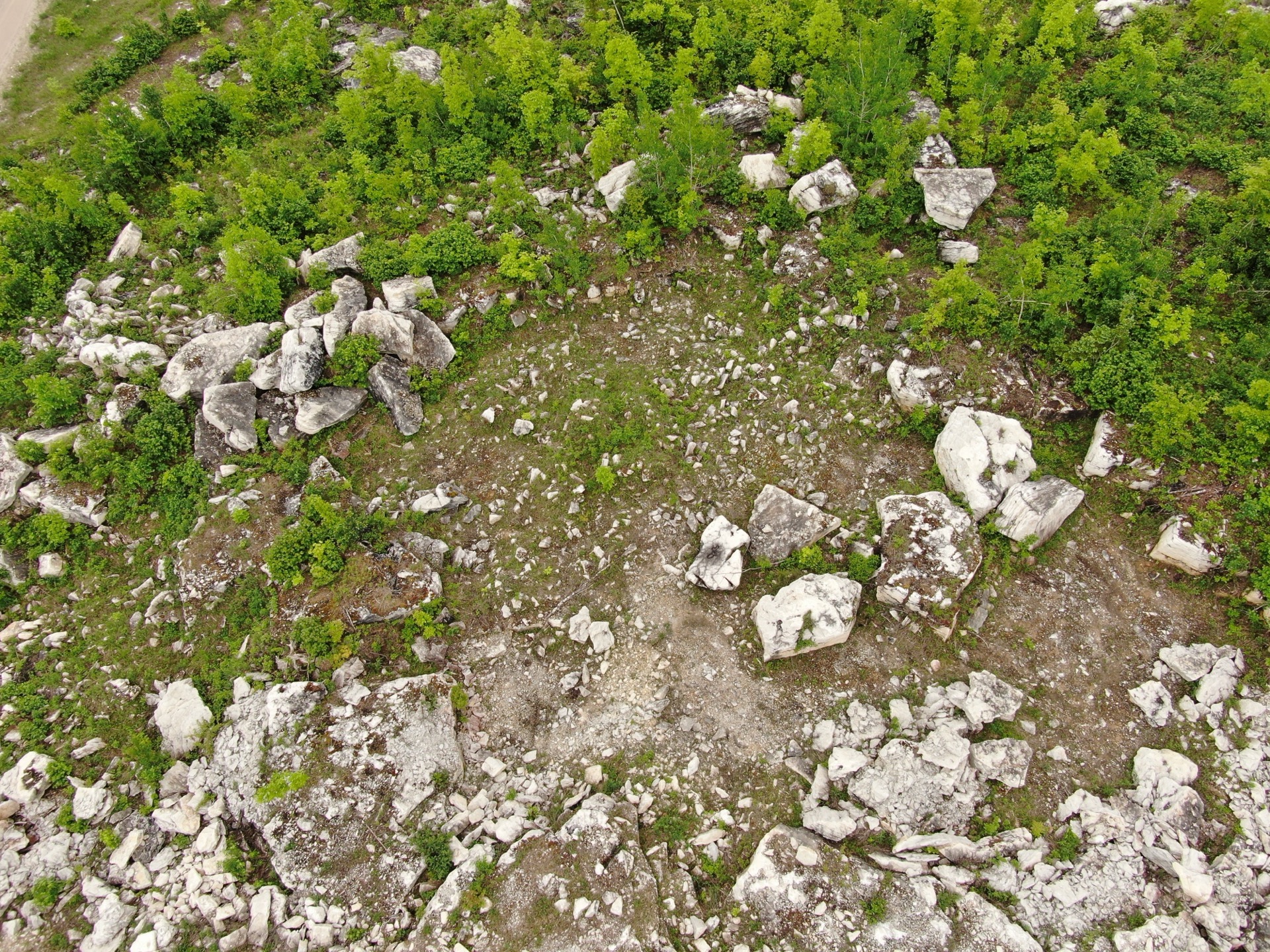 Large limestone boulders and processed stone at Stone Mountain quarry